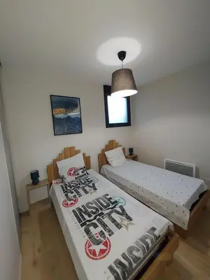 Un ou plusieurs lits dans un hébergement de l'établissement Appartement Mimizan Plage accès direct plage surveillée