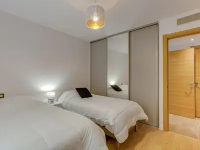 Un ou plusieurs lits dans un hébergement de l'établissement Apartment Domaine Aïga-2 by Interhome