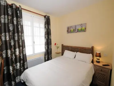 Un ou plusieurs lits dans un hébergement de l'établissement Hotel La Cabane