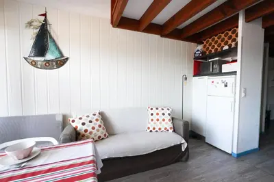 Un ou plusieurs lits dans un hébergement de l'établissement Appartement en duplex 2* Résidence Les Pêcheurs