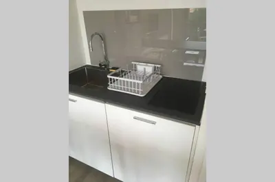Cuisine ou kitchenette dans l'établissement L escapade