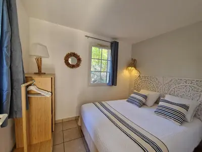 Un ou plusieurs lits dans un hébergement de l'établissement Appartements au coeur du golf, proche du lac et vélodyssée