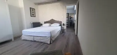 Un ou plusieurs lits dans un hébergement de l'établissement Villa Argentine Cosy