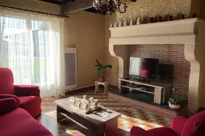 Coin salon dans l'établissement Gîte au coeur de la ferme