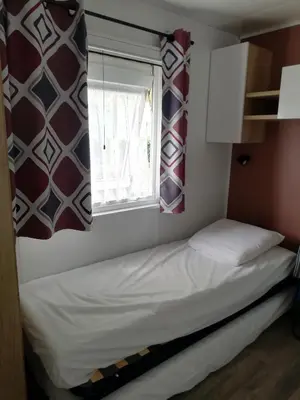 Un ou plusieurs lits dans un hébergement de l'établissement MOBILHOME GASTES LANDES