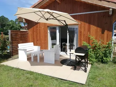 Jardin de l'établissement Appartement proche lac et plage