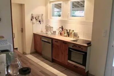 Cuisine ou kitchenette dans l'établissement Grande Maison Familiale entre lac et océan