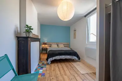 Un ou plusieurs lits dans un hébergement de l'établissement T2 3 étoiles de charme 40 m2 centre ville Dax