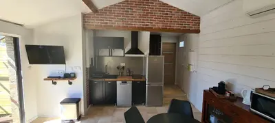 Cuisine ou kitchenette dans l'établissement Appartement Ychoux