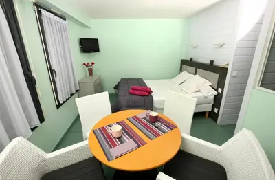 Télévision ou salle de divertissement dans l'établissement Thermotel