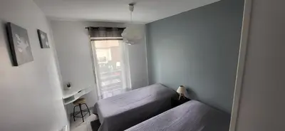 Un ou plusieurs lits dans un hébergement de l'établissement Appartement 2 chambres Balcon Parking privé Centre Village