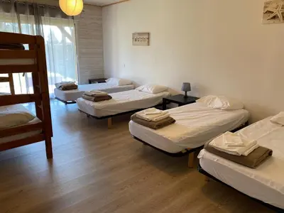 Un ou plusieurs lits dans un hébergement de l'établissement Ensemble de 3 villas avec piscine chauffée, esprit détente