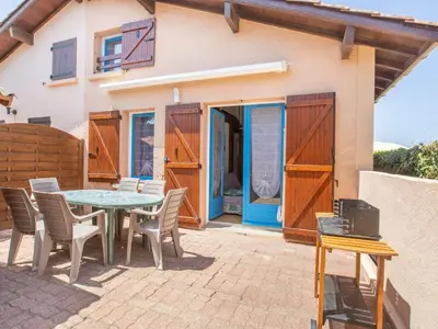 Balcon ou terrasse dans l'établissement Maison T2 Mezzanine à 350m des Plages avec Terrasse et Parking à Biscarrosse - FR-1-521-182