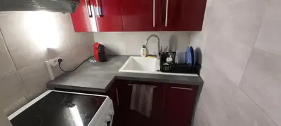 Cuisine ou kitchenette dans l'établissement Palm Appart