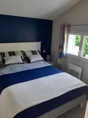 Un ou plusieurs lits dans un hébergement de l'établissement Chalet tout équipé, terrasse
