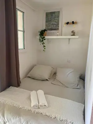 Un ou plusieurs lits dans un hébergement de l'établissement Appartement du Golf Les Bastides piscine et océan