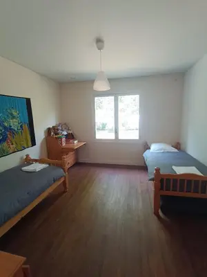 Un ou plusieurs lits dans un hébergement de l'établissement Maison dans le centre de messanges
