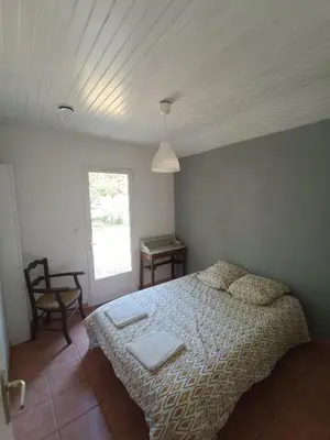 Un ou plusieurs lits dans un hébergement de l'établissement Maison dans le centre de messanges