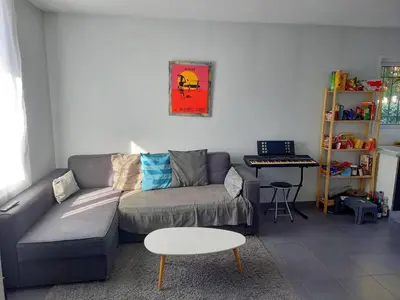 Coin salon dans l'établissement CAPBRETON -Appartement rez de jardin quartier proche centre et plages 5 pers