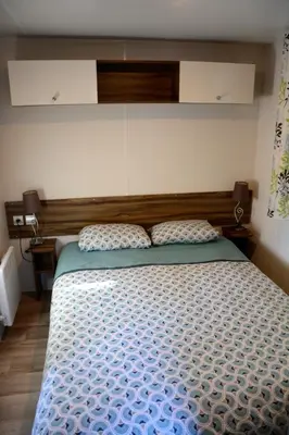 Un ou plusieurs lits dans un hébergement de l'établissement MOBILHOME 6/8 Personnes 3Ch LA RESERVE ****