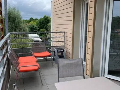 Balcon ou terrasse dans l'établissement Appartement Moderne Centre-Ville Biscarrosse - Plage à Proximité - 4 Pers - WiFi et Parking Inclus - FR-1-319-443
