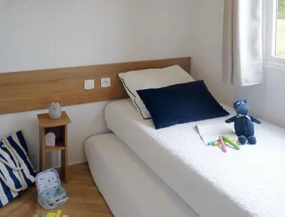 Un ou plusieurs lits dans un hébergement de l'établissement Évasion Lodge