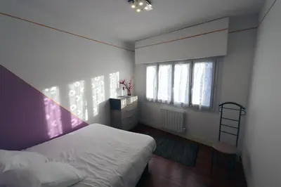 Un ou plusieurs lits dans un hébergement de l'établissement APPARTEMENT 1 à 9 personnes Hagetmau coeur de ville