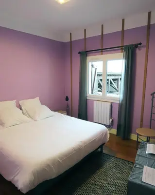 Un ou plusieurs lits dans un hébergement de l'établissement APPARTEMENT 1 à 9 personnes Hagetmau coeur de ville