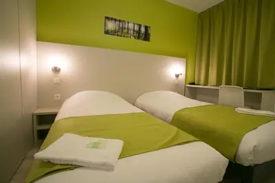 Un ou plusieurs lits dans un hébergement de l'établissement Motel des Landes