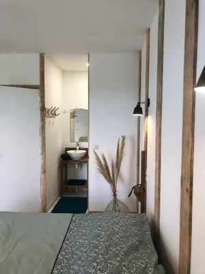 Un ou plusieurs lits dans un hébergement de l'établissement Chambres d’hôtes Arremounon