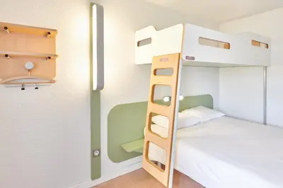Un ou plusieurs lits dans un hébergement de l'établissement ibis budget Saint Paul Les Dax