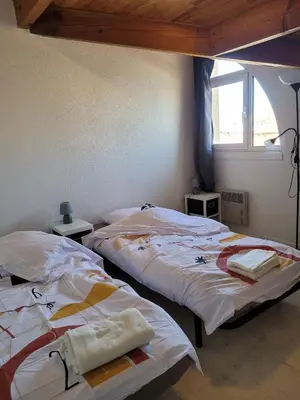 Un ou plusieurs lits dans un hébergement de l'établissement Appartement T3 Bord de plage