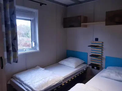 Un ou plusieurs lits dans un hébergement de l'établissement AE village