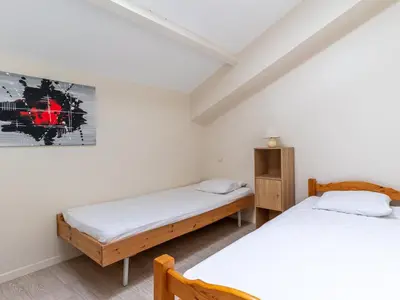 Un ou plusieurs lits dans un hébergement de l'établissement Duplex à Mimizan Plage pour 7 pers, parking, face océan, classé 3 étoiles - FR-1-50-92
