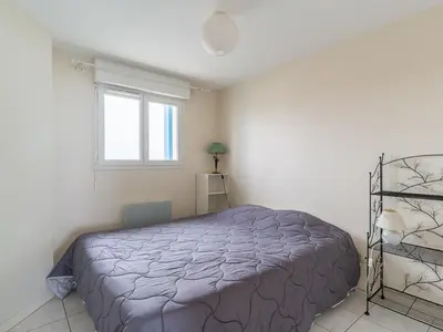 Un ou plusieurs lits dans un hébergement de l'établissement Duplex à Mimizan Plage pour 7 pers, parking, face océan, classé 3 étoiles - FR-1-50-92