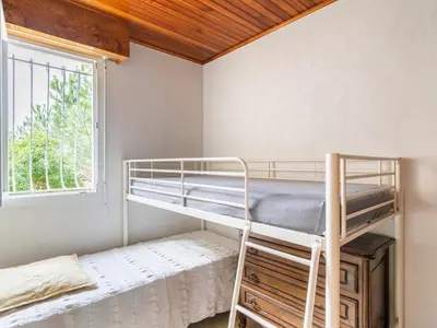 Un ou plusieurs lits dans un hébergement de l'établissement Duplex centre station Biscarrosse 6 pers, terrasse, WIFI, parking, équipements complets - FR-1-521-193
