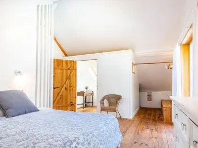 Un ou plusieurs lits dans un hébergement de l'établissement Holiday Home La Grange du Belon by Interhome