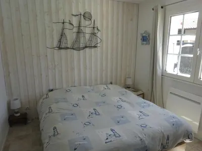 Un ou plusieurs lits dans un hébergement de l'établissement Maison familiale Landaise pour 2 couples, enfants