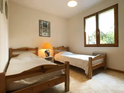 Un ou plusieurs lits dans un hébergement de l'établissement Maisonnette 3 chambres proche Océan - Animaux admis - FR-1-379-145