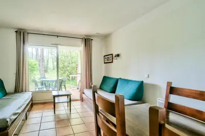 Coin salon dans l'établissement Le Domaine du Golf de Pinsolle - maeva Home - Appartement 2 Pièces 5 Personnes - Confort MAE-3626