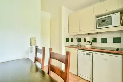 Cuisine ou kitchenette dans l'établissement Le Domaine du Golf de Pinsolle - maeva Home - Appartement 2 Pièces 5 Personnes - Confort MAE-3626
