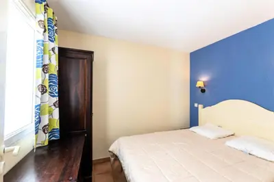 Un ou plusieurs lits dans un hébergement de l'établissement Le Domaine du Golf de Pinsolle - maeva Home - Appartement 2 pièces 6 personnes - Confort MAE-2684