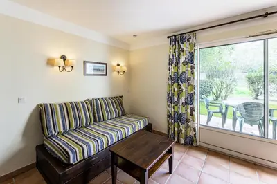 Coin salon dans l'établissement Le Domaine du Golf de Pinsolle - maeva Home - Appartement 2 pièces 6 personnes - Sélection MAE-2694
