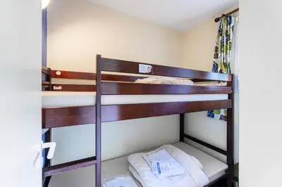Un ou plusieurs lits dans un hébergement de l'établissement Le Domaine du Golf de Pinsolle - maeva Home - Appartement 2 pièces 6 personnes - Sélection MAE-2694