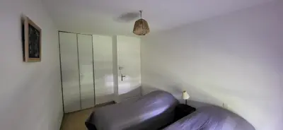 Un ou plusieurs lits dans un hébergement de l'établissement Appartement Lit et Mixe