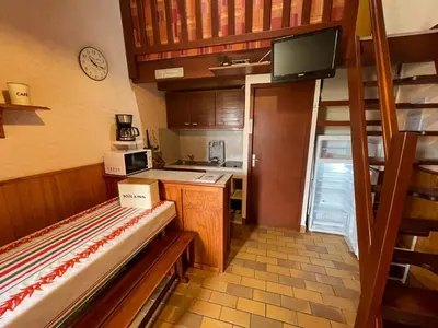 Cuisine ou kitchenette dans l'établissement Mer du Sud