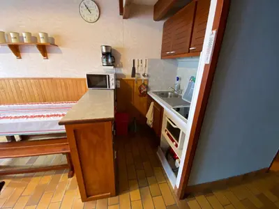 Cuisine ou kitchenette dans l'établissement Mer du Sud