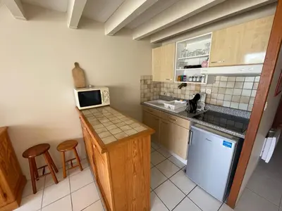 Cuisine ou kitchenette dans l'établissement L'Abri Côtier