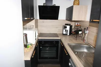 Cuisine ou kitchenette dans l'établissement maison de la plage et du golf