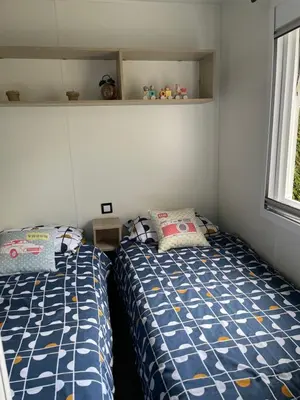 Un ou plusieurs lits dans un hébergement de l'établissement Le mobilhome de Evelyne et Serge